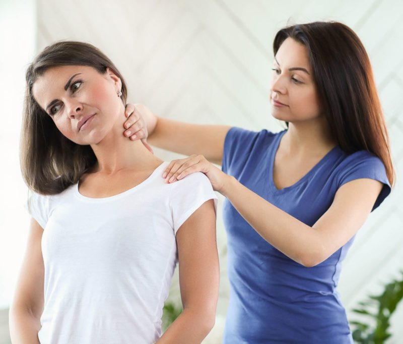 woman receiving treatment for her neck